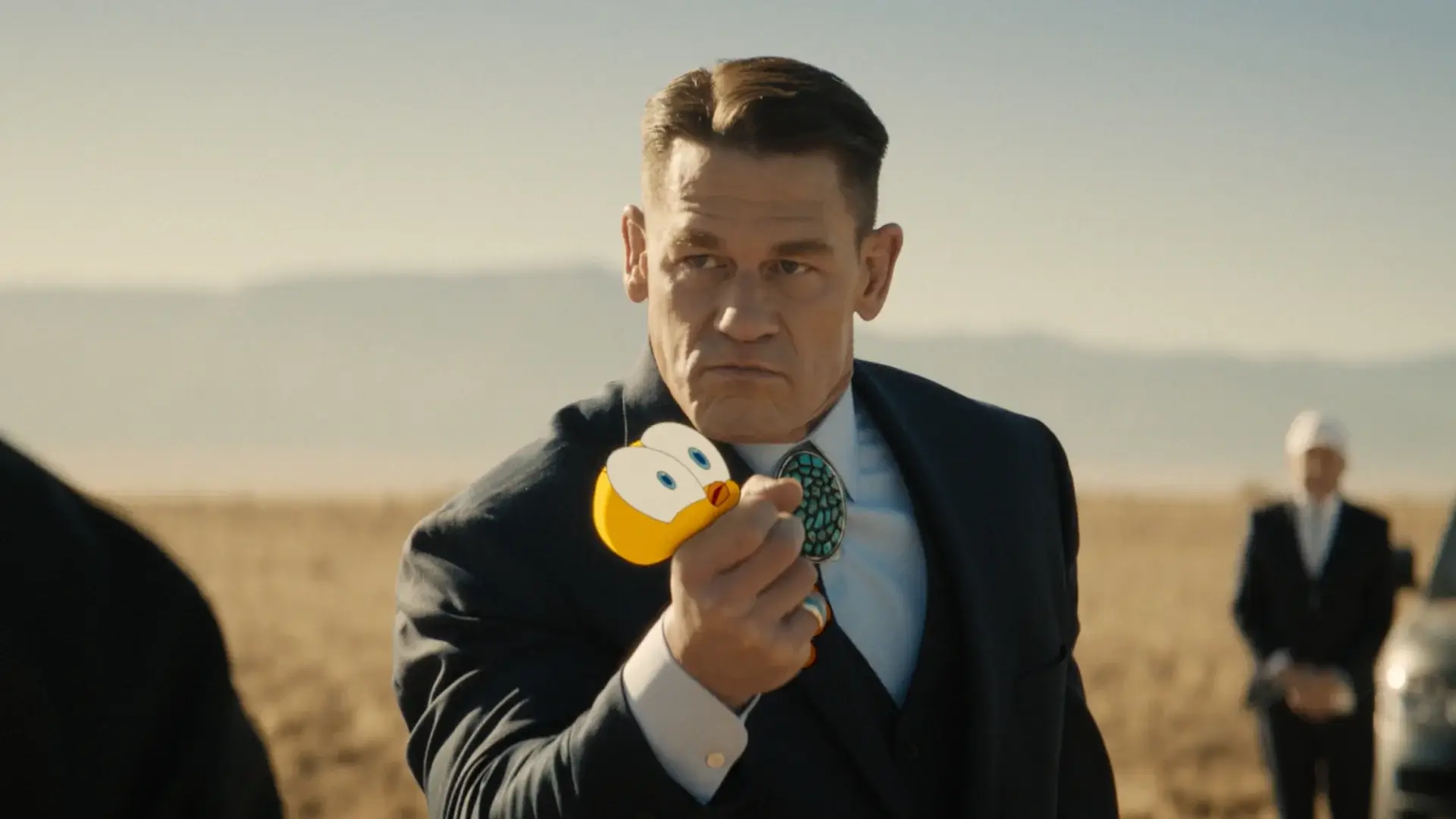 John Cena squeezes Tweety Bird during a desert interrogation in Coyote vs Acme.