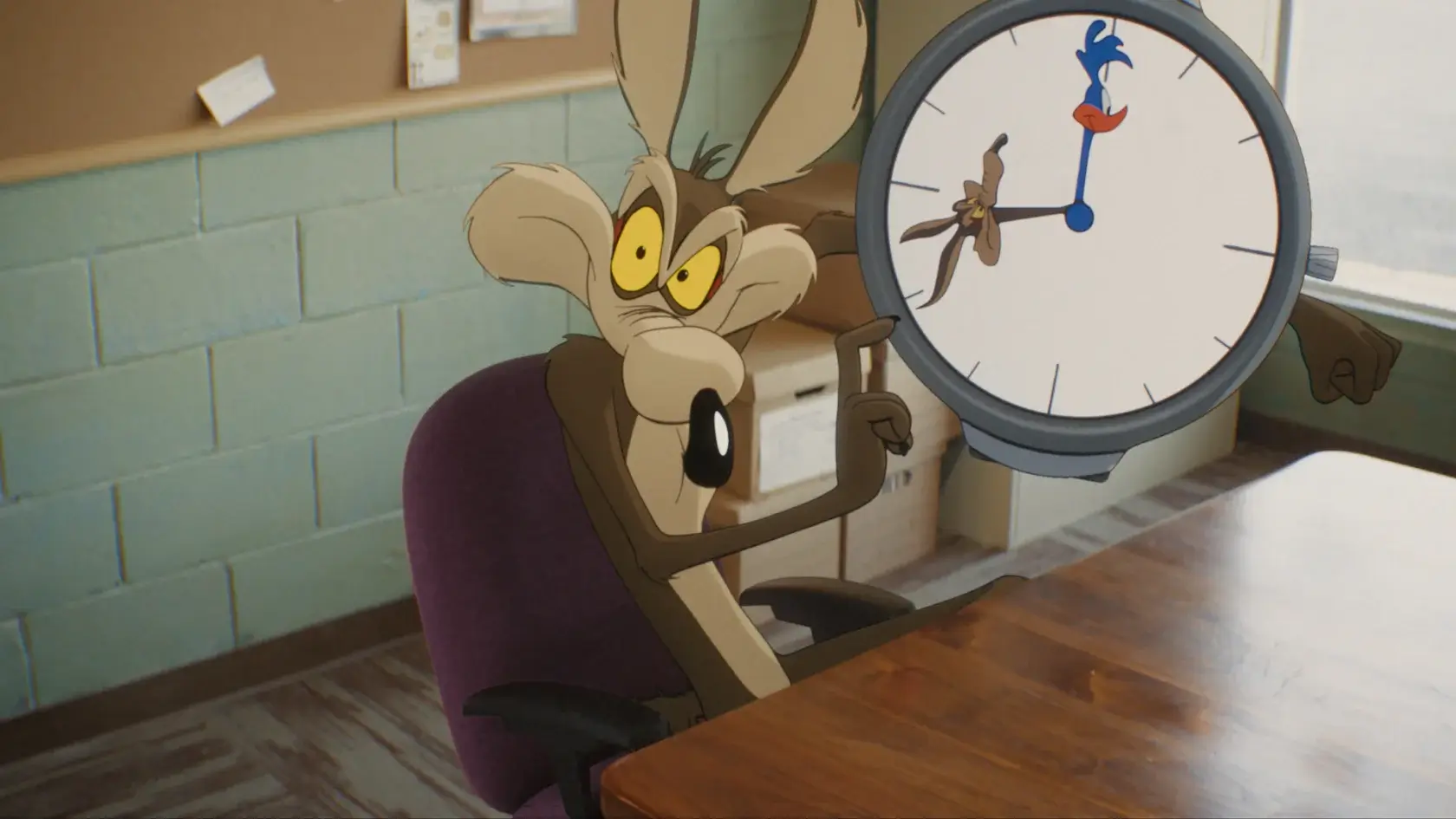 Wile E Coyote menacingly points to a cartoon clock in an office in Coyote vs Acme.