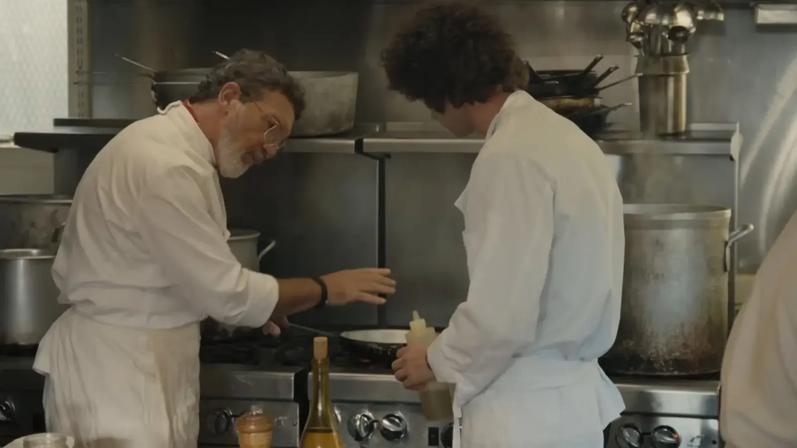 Antonio Banderas as Chef and Dominic Sessa as Anthony Bourdain in Tony
