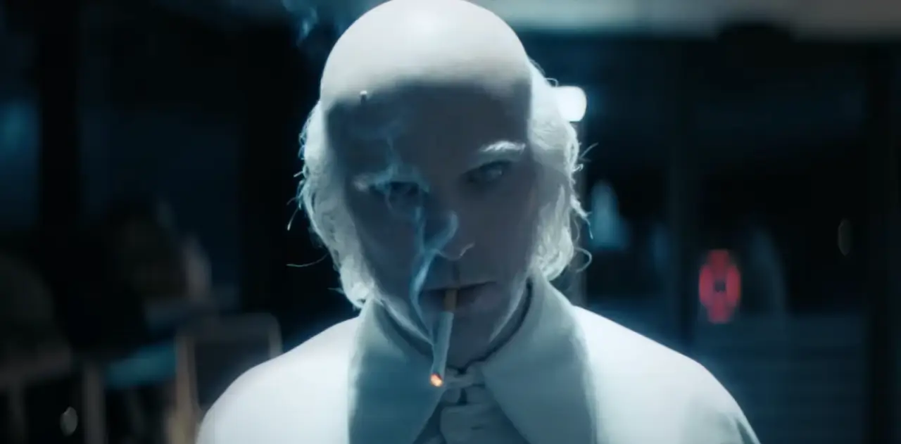 Dan Stevens smokes a cigarette as Dr. Kammler in Onslaught
