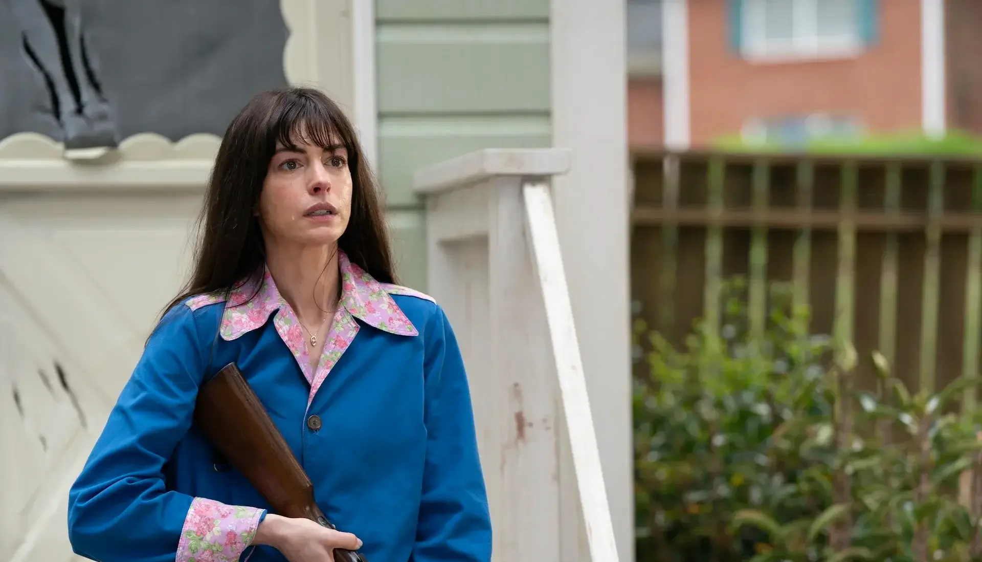 Anne Hathaway with a gun