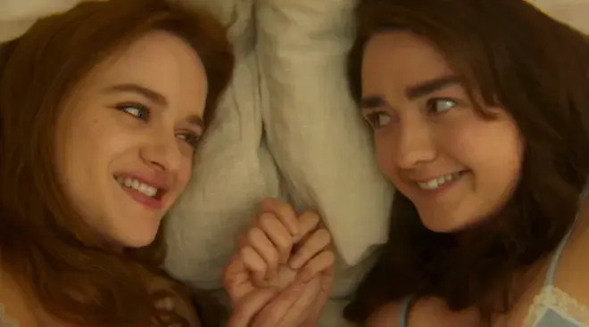 Joey King as Kiley Owens and Maisie Williams as Antonia Owens laying in bed together in Practical Magic 2