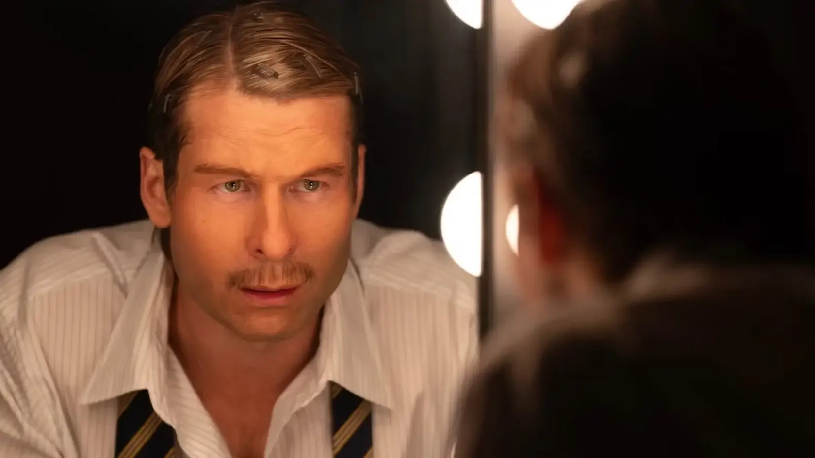 man looking in a mirror