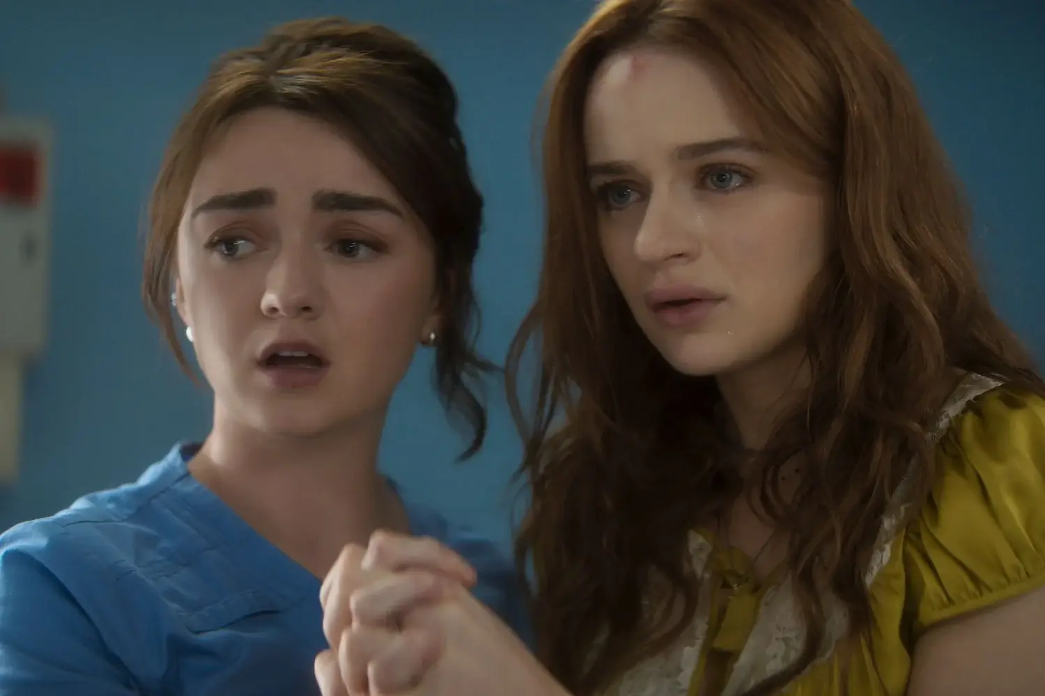 Maisie Willliams as Anotnia Owens and Joey King as Kylie Owens in the hospital room in Practical Magic 2