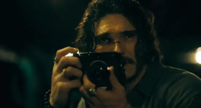 Man holding camera.
