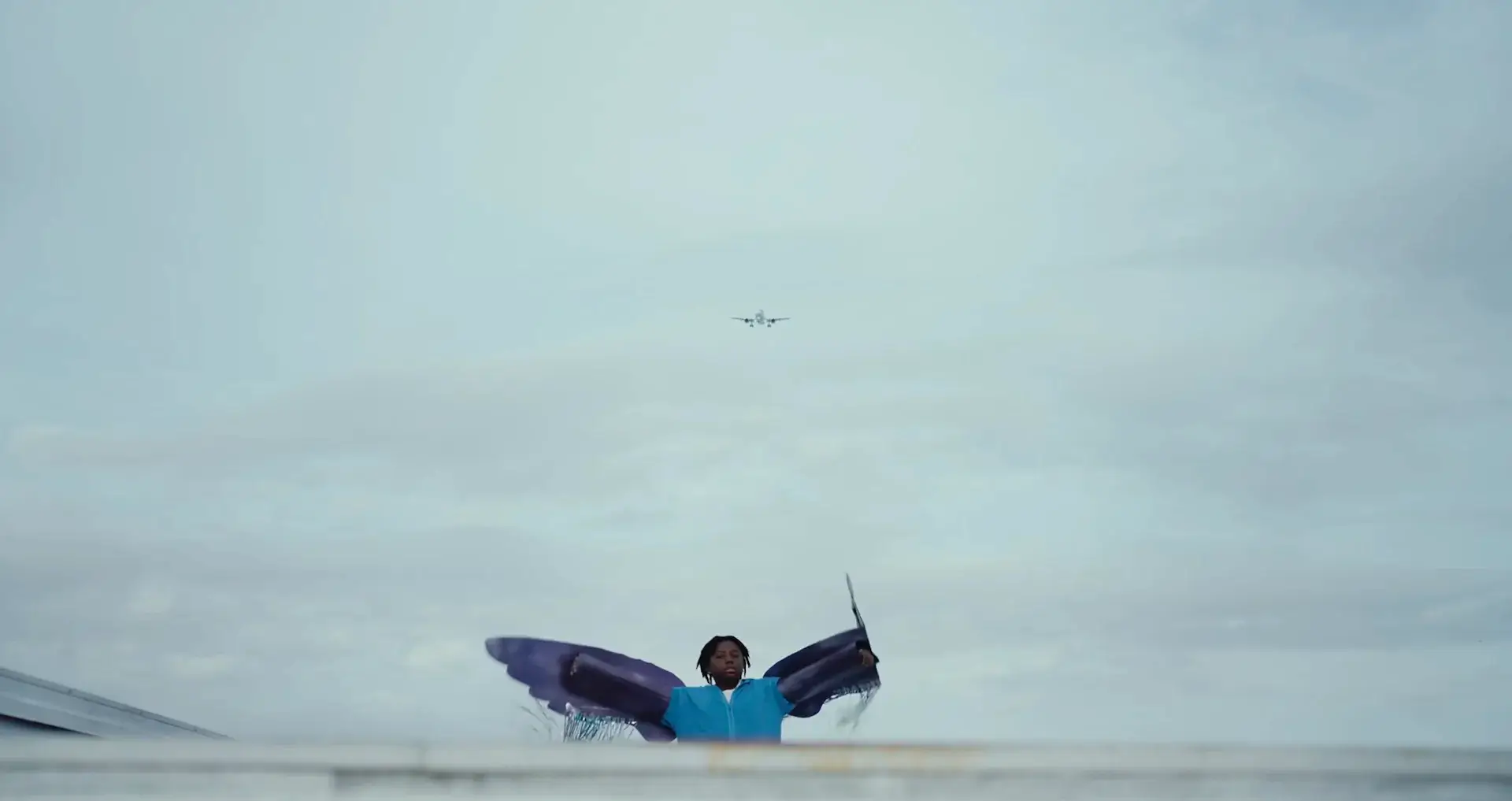 Boy with paper wings.