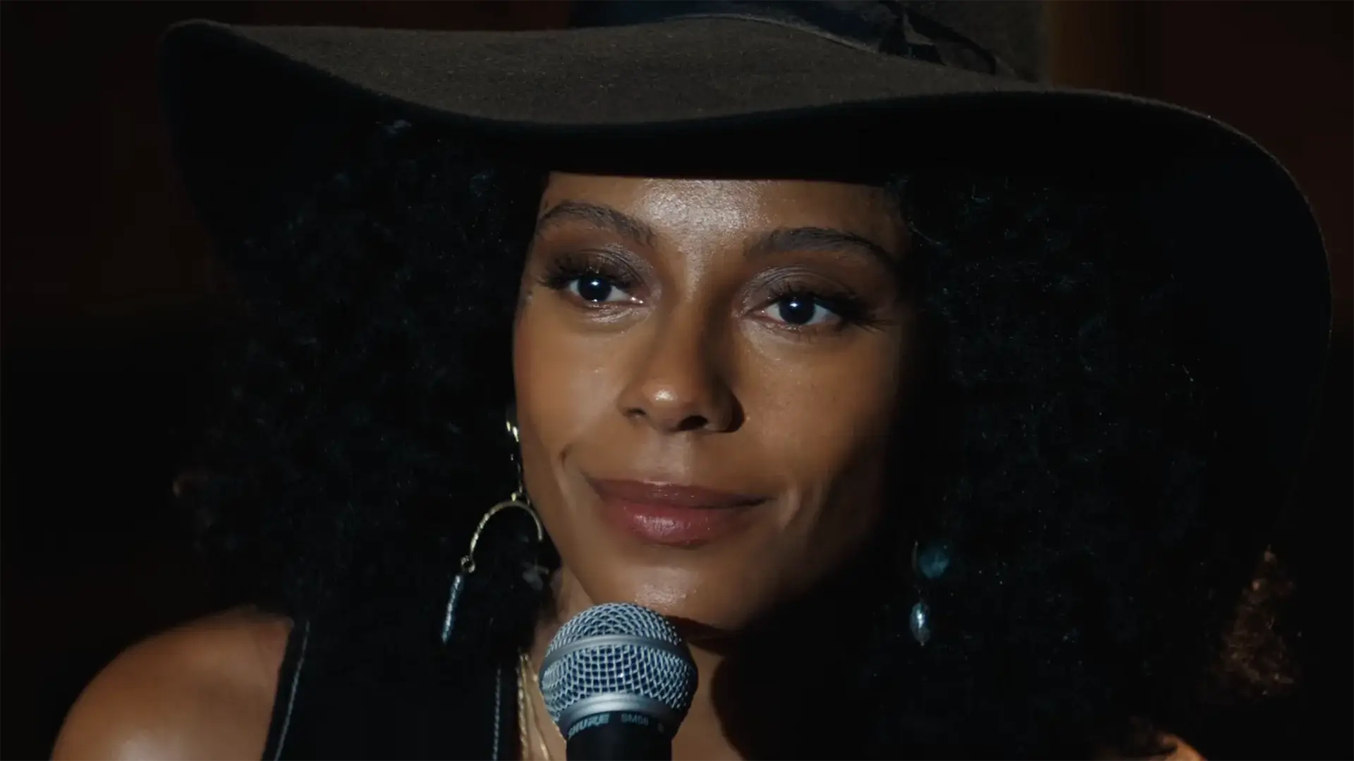 Woman in a hat with a microphone