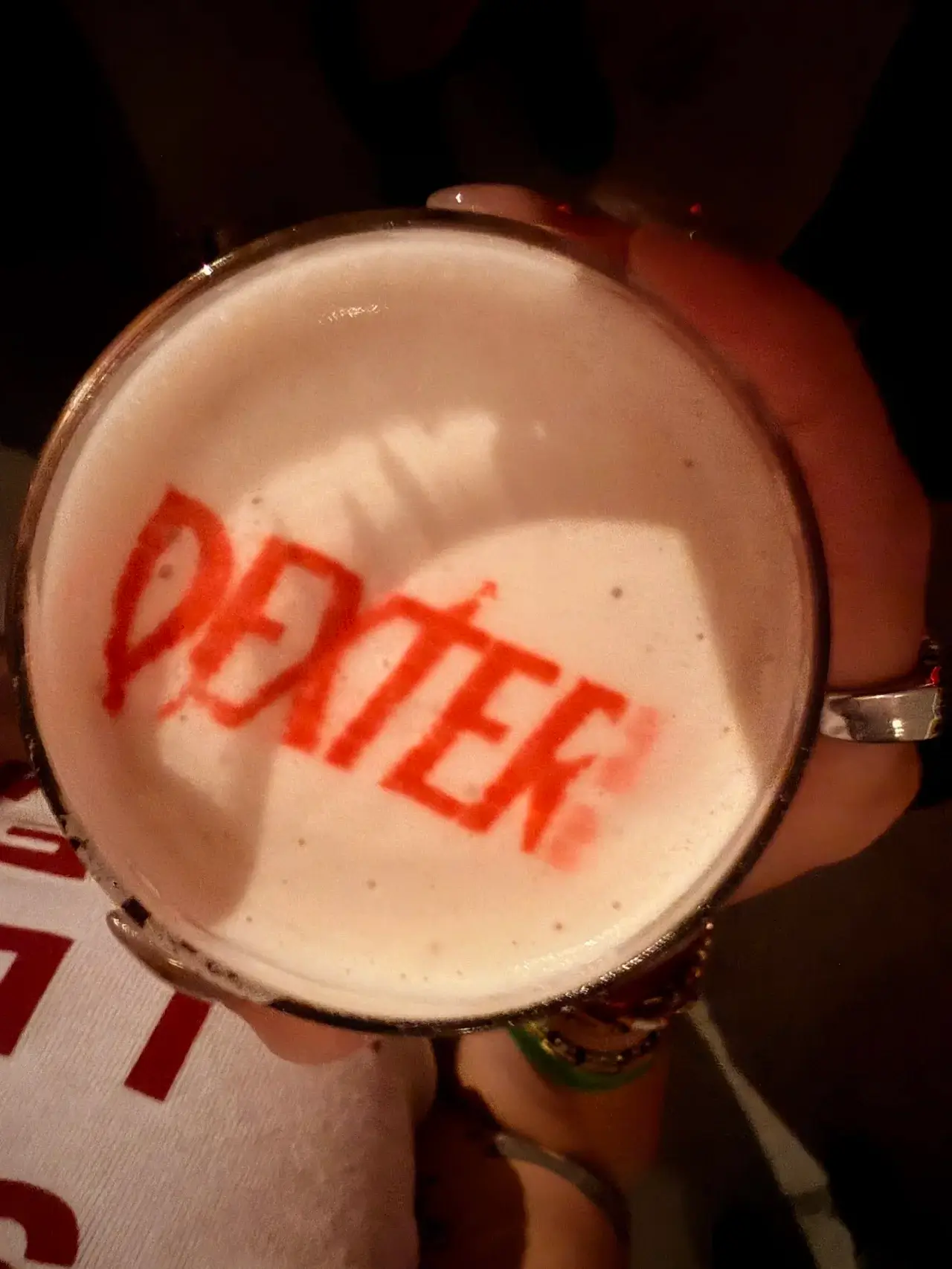 Cocktail with word printed on top.