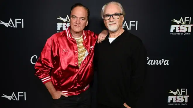 Two men looking into the camera