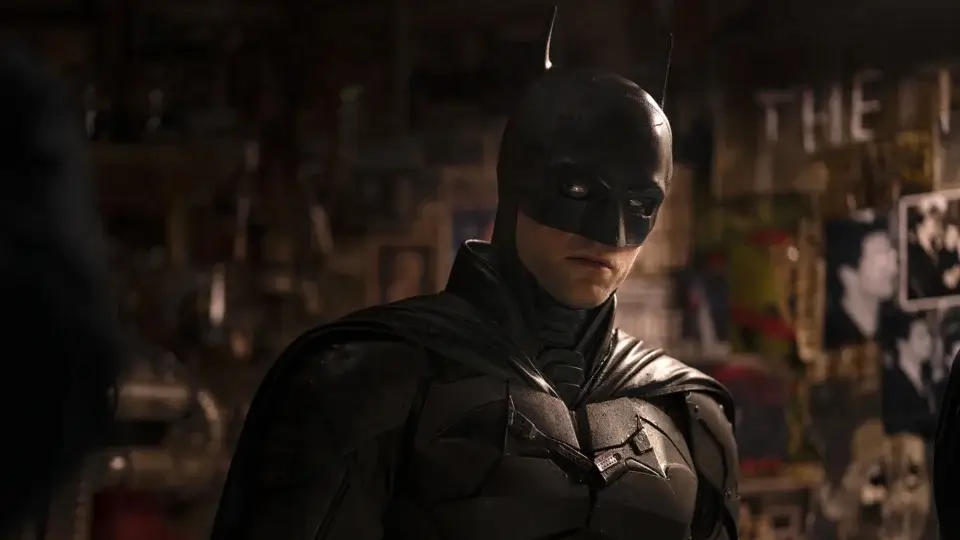 A man in a dark bat costume